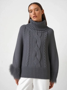 Grey turtleneck cable knit sweater featuring luxury faux fur cuffs for a chic winter style