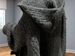Detail of grey thickened knit hoodie with plush texture for winter warmth