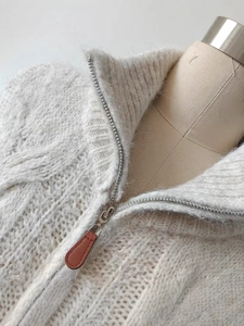 White alpaca wool sweater with twist knit, dual zipper collar and loose knit texture