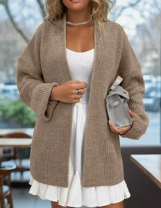 Close-up of earth-toned rib knit cardigan texture on a street-style model