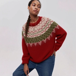 Fair Isle knit sweater featuring red festive patterns and loose fit for a cozy look