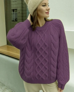 Detailed view of purple cable-knit sweater texture with classic diamond pattern