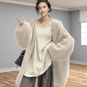 Women's cream knit cardigan sweater in oversized V-neck style with lantern sleeves
