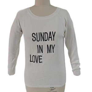 Detail of Sunday In My Love letter print on white crewneck knit sweater with ribbed cuffs