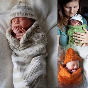 Macro view of textured cable knit pattern on newborn swaddle blanket and matching beanie cap