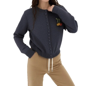 Dark blue knit cardigan with cherry embroidery and button closure on white background