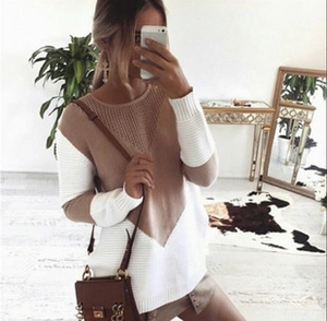 Detail of V-shaped color-block knit sweater with hollow mesh neck and ribbed cuffs