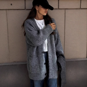 Women's V-neck dark grey knit cardigan sweater with large pockets and classic black buttons