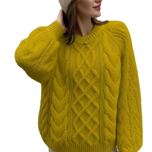 Thick cable knit sweater with round neck in mustard yellow color for autumn and winter