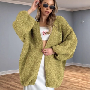 Oversized mustard yellow chunky knit cardigan with lantern sleeves and textured finish