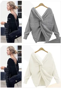 Detail view of a V-neck backless knit sweater with a unique twist knot design in ivory and gray