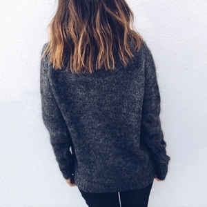 Women's dark grey loose knit sweater with long sleeves and cozy mohair texture
