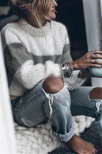 Detailed knit texture of wide striped mohair sweater with loose fit and casual round neck