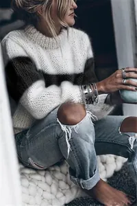 Detailed texture of loose oversized mohair knit sweater with black and white stripes