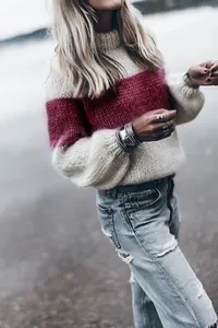 Close-up of women's mohair knit sweater featuring striped pattern and lantern sleeves