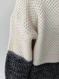 Close-up of contrast stitching and knit texture on this casual striped women sweater