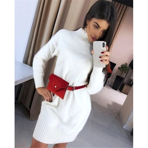 White high-neck knit mini dress with long sleeves and stylish red waist bag accessory