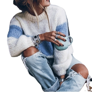 Loose knit mohair sweater with cream and light blue stripes on a white background