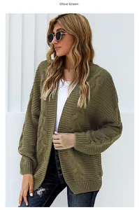 Detailed view of the olive green cable knit texture and ribbed cuffs on the oversized cardigan