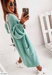 Detail of mint green oversized knit cardigan with ribbed cuffs and large side pockets