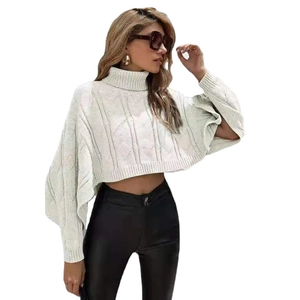Women's off-white turtleneck knit poncho sweater featuring classic cable knit and batwing sleeves