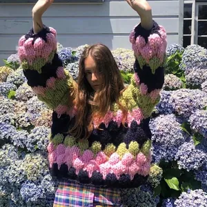 Winter handmade chunky knit sweater with colorful block pattern in a relaxed loose fit