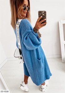 Detailed texture of thick knit royal blue cardigan featuring ribbed cuffs and large pockets