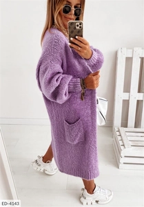 Detail shot of purple chunky knit long cardigan with large side pockets and ribbed cuffs