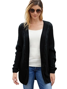 Detail of loose cable knit texture on a black oversized long-sleeve cardigan sweater