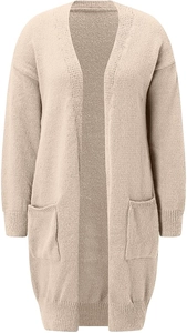 Detail of chunky knit texture and large front pockets on a beige cardigan sweater