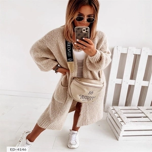 Chunky knit oversized beige cardigan sweater for women with drop shoulders and large pockets