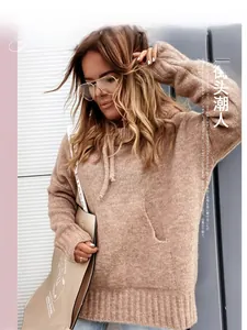 Detail of light coffee knitted hoodie featuring a kangaroo pocket and drawstring hood
