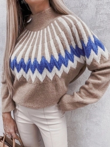 Detail of high-neck knit sweater with blue and white geometric jacquard pattern on brown