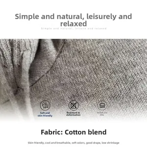 Close-up detail of soft grey cotton blend knit fabric texture for hooded sweater