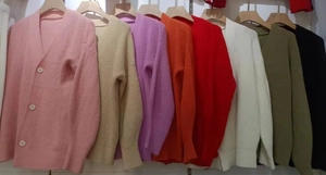 Detailed display of eight-color solid knit cardigans with ribbed cuffs and V-neckline