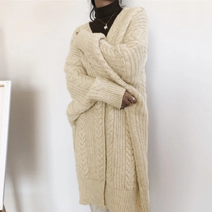 Chunky cable knit oversized beige cardigan sweater for women in longline relaxed silhouette