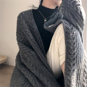 Deep grey oversized cable knit cardigan with chunky wool texture and drop shoulders