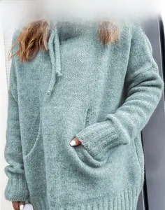 Detailed view of mint green chunky knit hoodie featuring a drawstring and kangaroo pocket