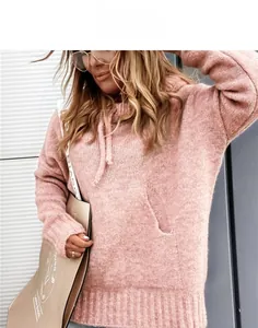 Detail of pink knitted hoodie featuring a drawstring hood and kangaroo pocket