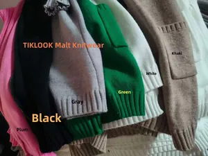 Detail showing various colors of long knit cardigans with ribbed cuffs and side pockets