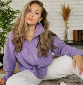 Cozy purple chunky knit sweater with half-zip collar shown in a lifestyle home setting