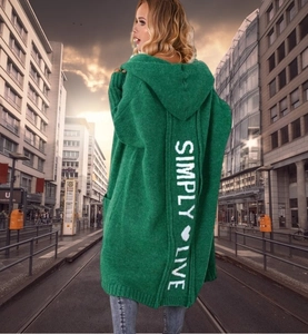 Detail of green chunky knit cardigan with Simply Live back print and heart pattern