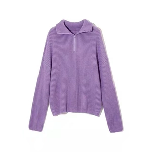 Detail of purple ribbed knit texture on half-zip turtleneck sweater with metallic zipper