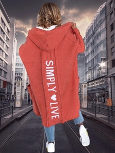 Back view of orange knit cardigan featuring vertical Simply Live text and heart design