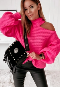Close-up detail of hot pink knit sweater featuring shoulder cutout and ribbed texture