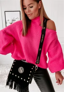 Detail view of bright pink off-shoulder knit sweater with a black fringed rivet shoulder bag
