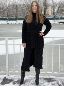 Long black cable knit cardigan with adjustable waist belt and textured knit pattern
