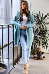 Detail of light blue hooded knit cardigan showing ribbed cuffs and soft fabric texture