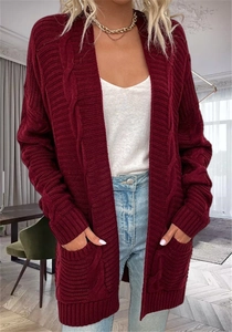Detail of burgundy cable knit texture and large pocket on casual long cardigan