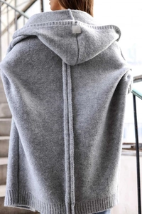 Detail view of the gray hooded knit cardigan showing back seam and textured fabric